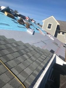 Asphalt shingles being installed on a roof