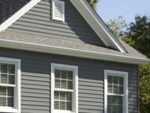 A luxury home with new vinyl siding